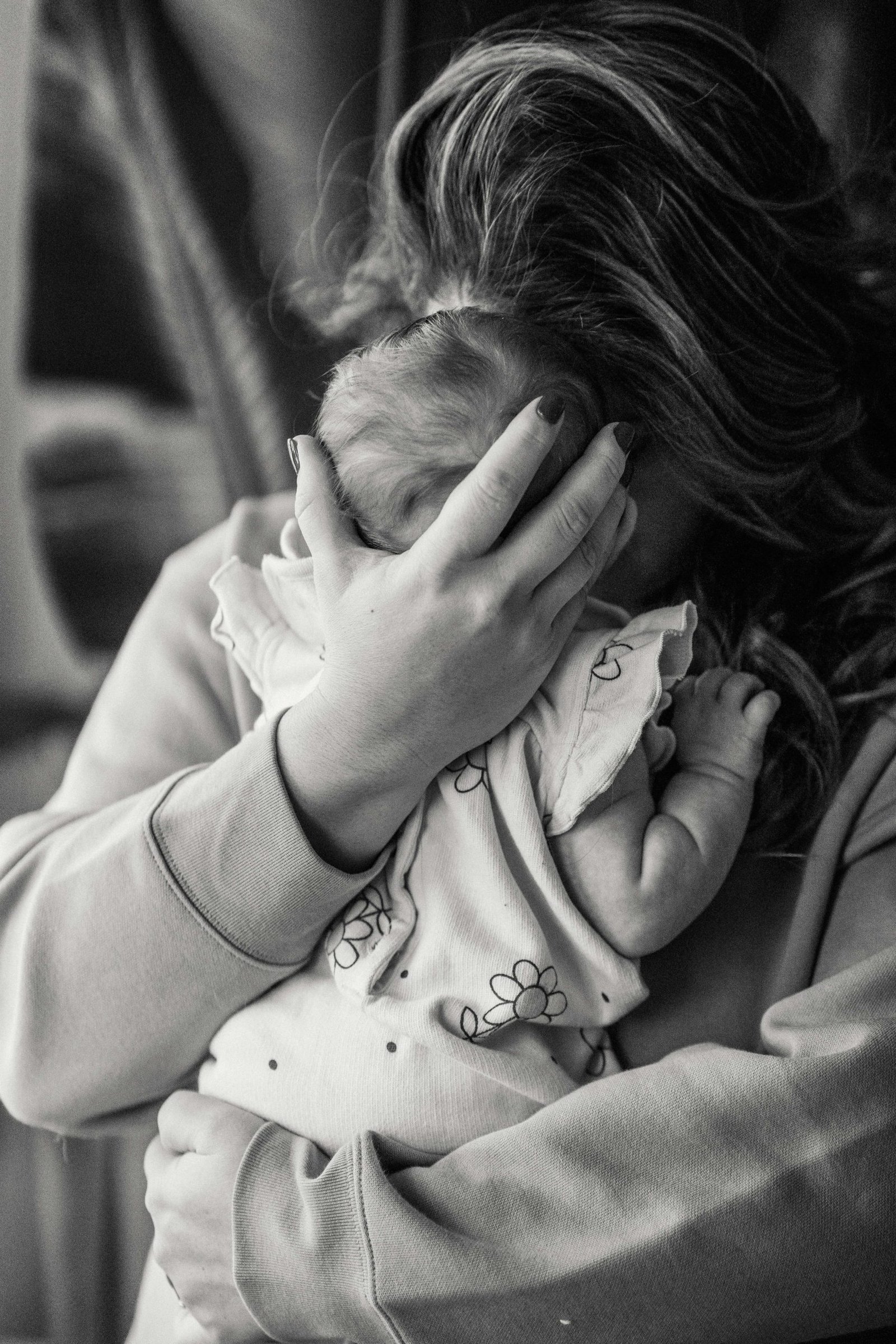 A woman holds her baby closely. Take charge of your maternal mental health with postpartum anxiety and depression therapy. Learn how telehealth services in the Denver, Colorado area can help you feel closer to your child and closer to your true self.
