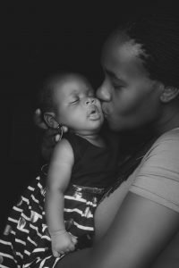 Mom kisses baby | telehealth therapy in englewood, co | maternal mental health therapist | postpartum anxiety therapy | Englewood, CO 80128 | 80111 | Greenwood Village, CO 80126 | 80129 A woman kisses her baby on the cheek. If you’re experiencing depression after birth, find out how a maternal mental health therapist in Greenwood Village, CO, can help you overcome postpartum anxiety and postpartum depression.